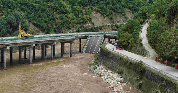 At least 11 dead, dozens missing after a highway bridge in China collapses after heavy storms At least 11 dead, dozens missing after a highway bridge in China collapses after heavy storms