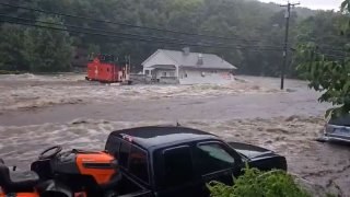 At least 1 person missing and about 100 evacuated by rescue crews as flash flooding hit parts of Connecticut and New York