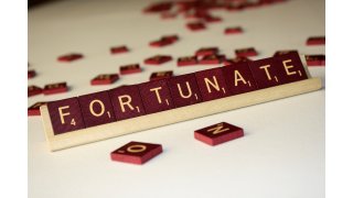 Fortunate Meaning and Definition